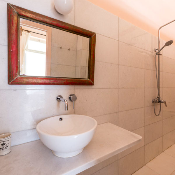 marble bathroom with a shower