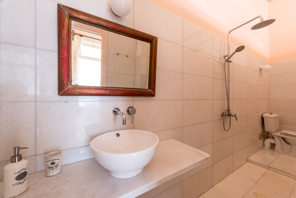 marble bathroom with a shower