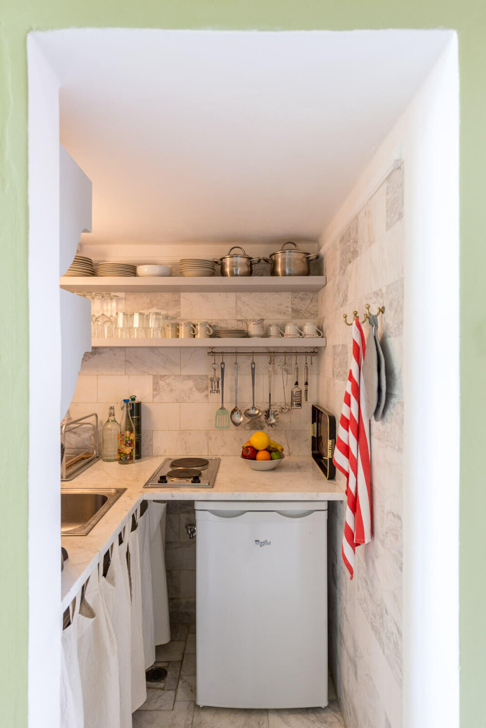Communal kitchenette with two other rooms